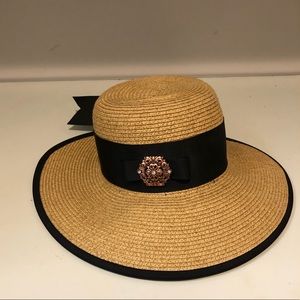 Straw hat with black ribbon